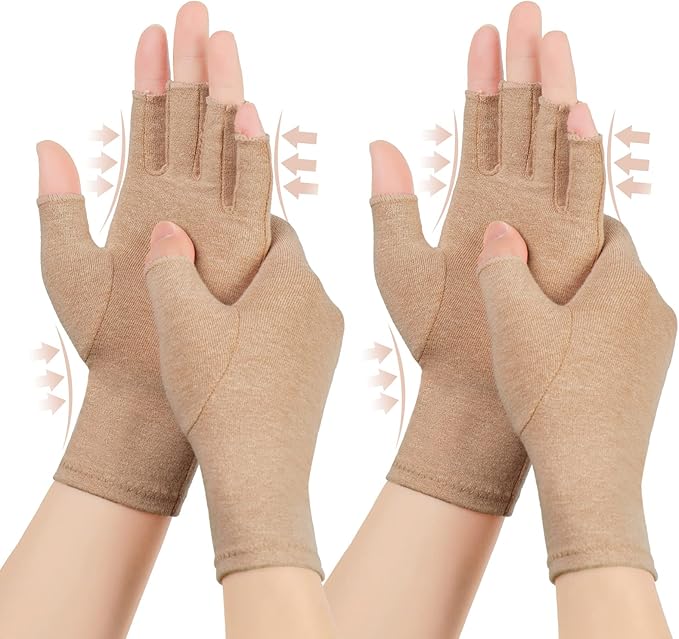 Pair of brown open-finger compression gloves for arthritis being worn on hands, showing gentle pressure arrows around the wrists and fingers for joint pain relief.