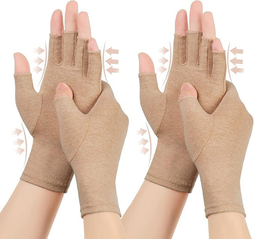 Pair of brown open-finger compression gloves for arthritis being worn on hands, showing gentle pressure arrows around the wrists and fingers for joint pain relief.